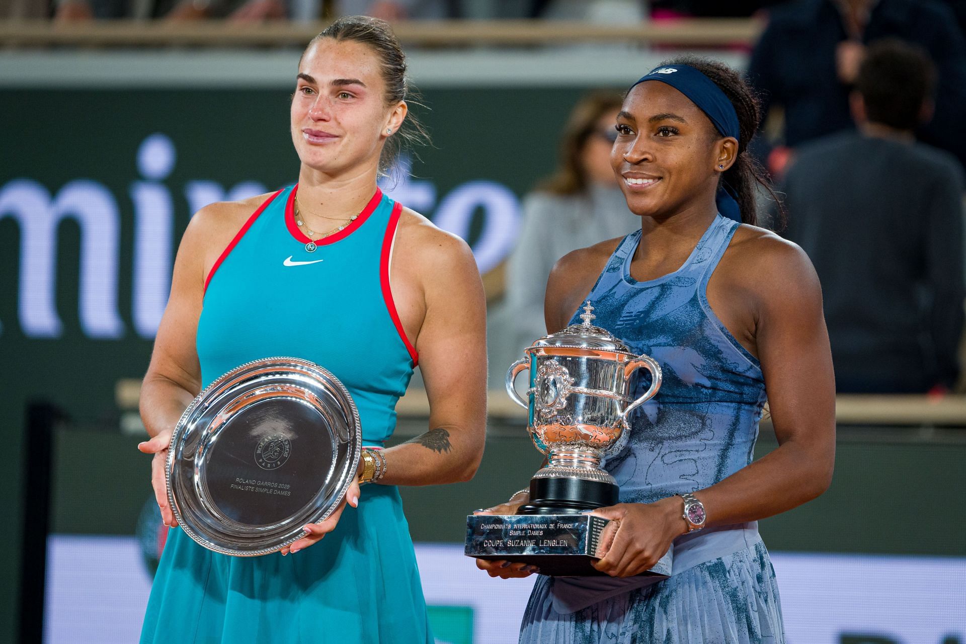 Aryna Sabalenka and Coco Gauff with their 2025 French Open trophies - Source: Getty